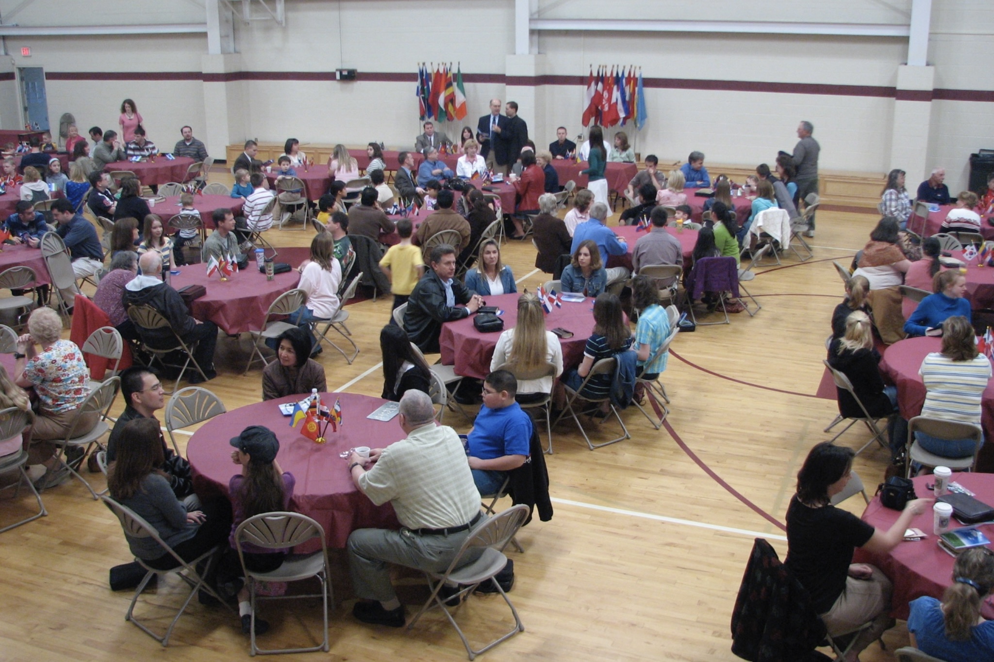 Busy vendor and exhibitor event with guests exploring displays