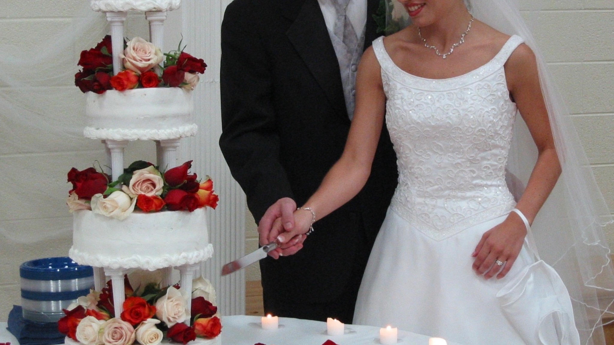 Bride and groom cutting their wedding cake