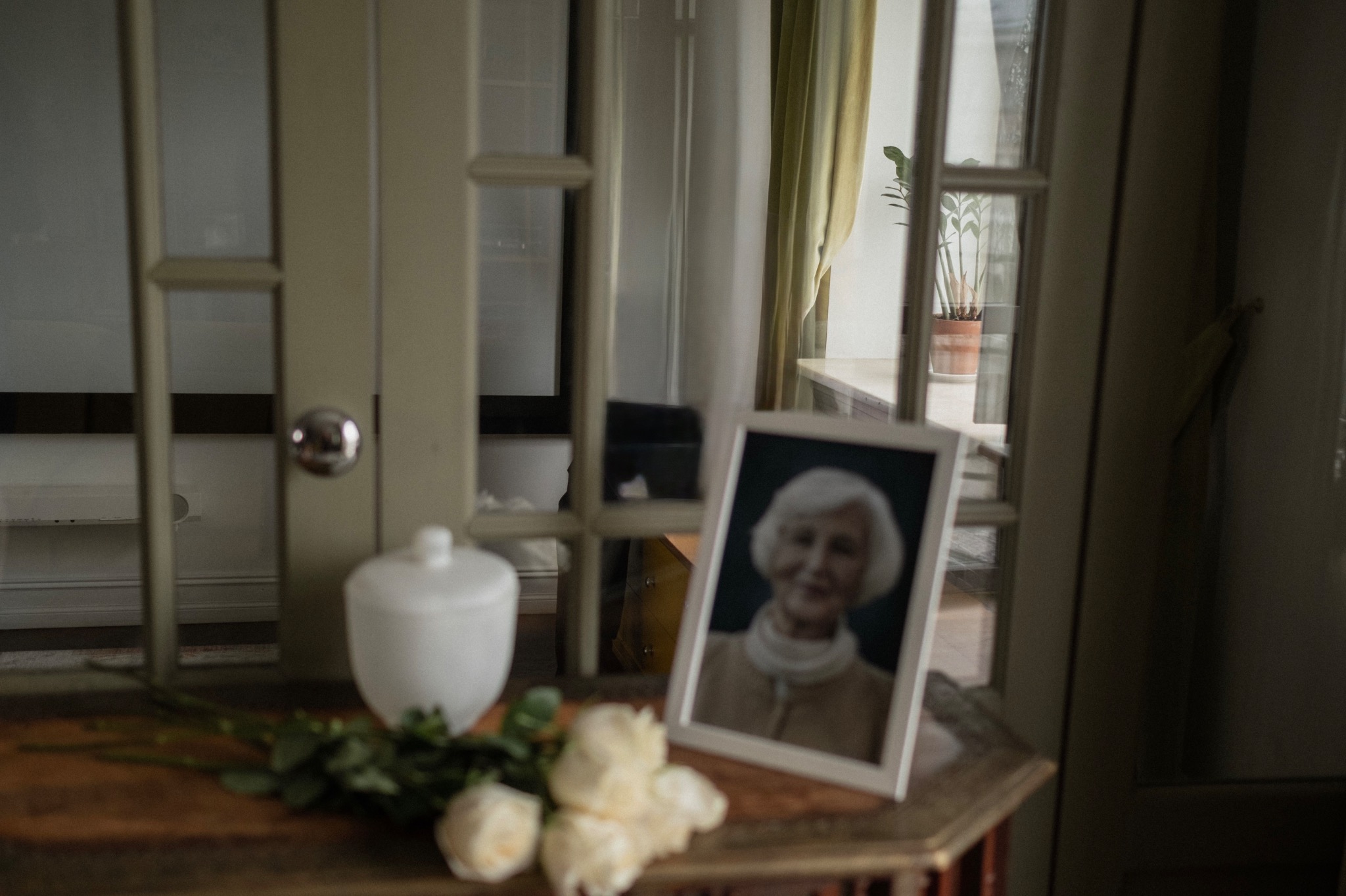 Memorial portrait with white roses