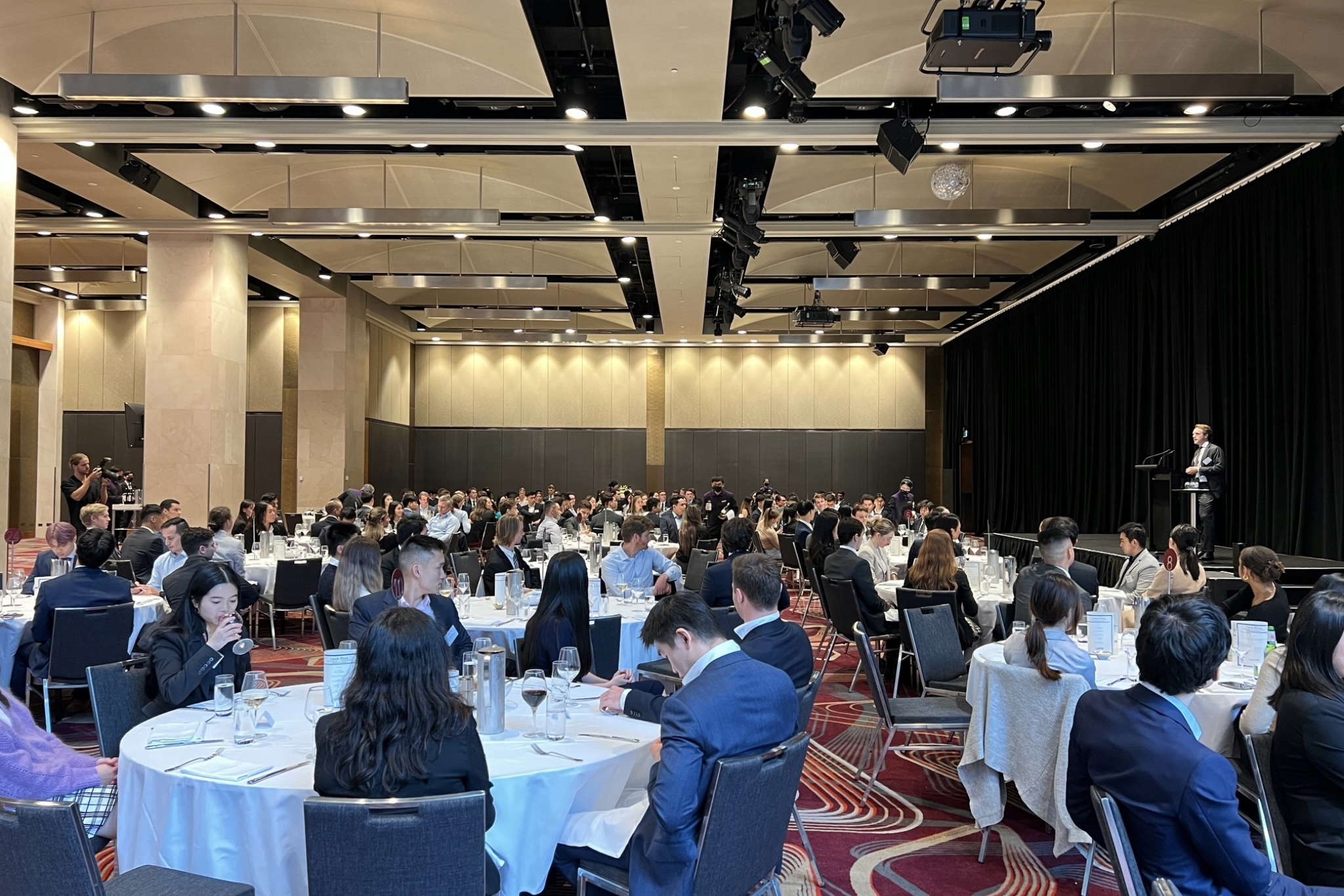 Professional attendees seated together at a conference