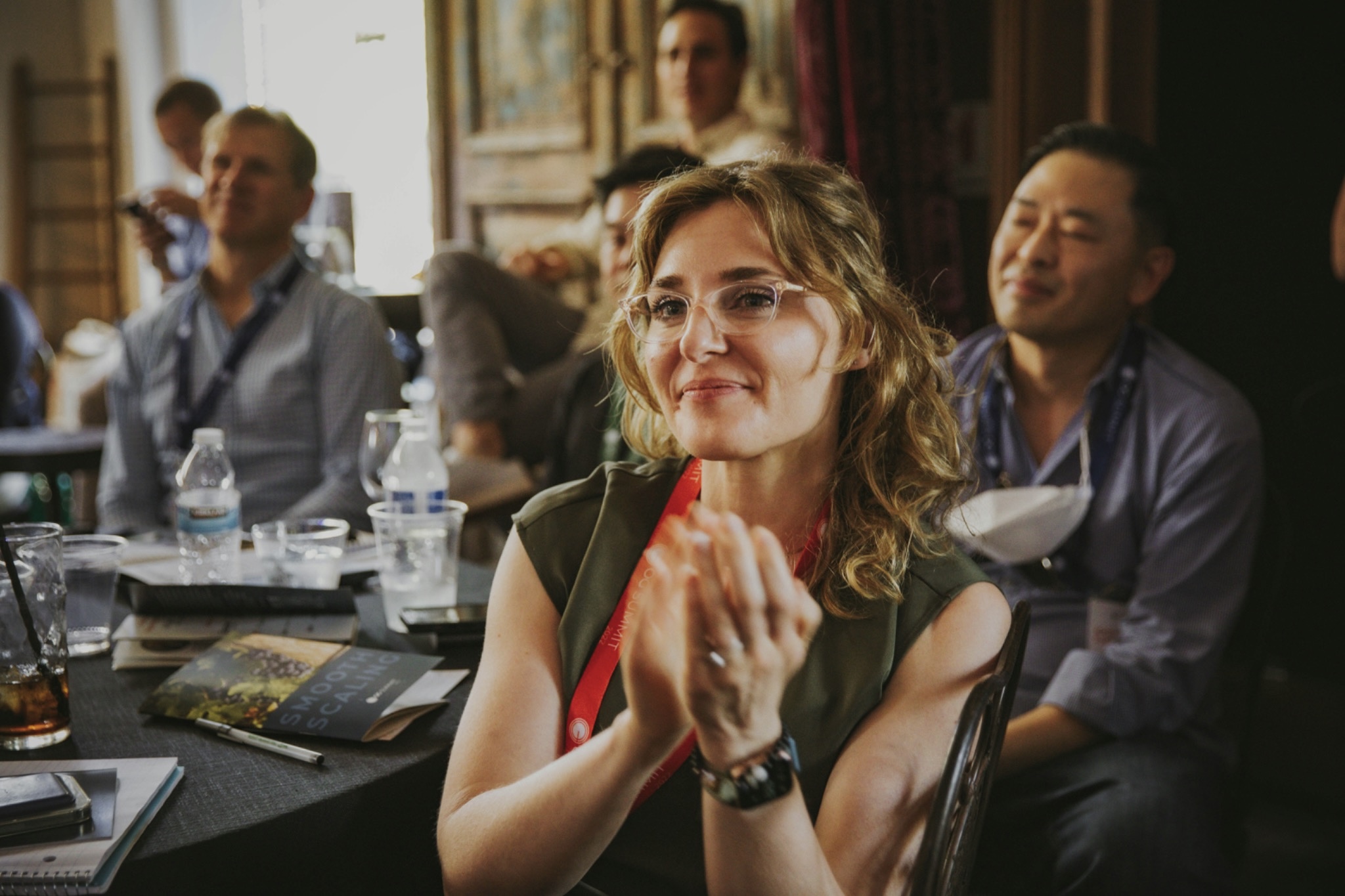 An audience listening to a speaker at a professional event